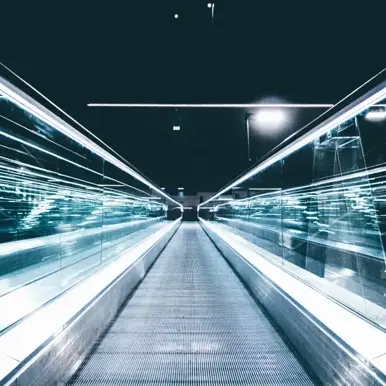 Walking escalator with bright lights