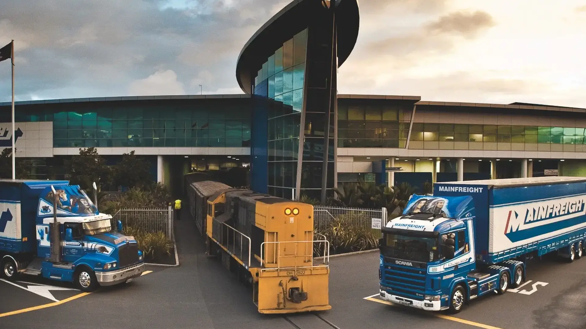 Mainfreight truck with train on rail