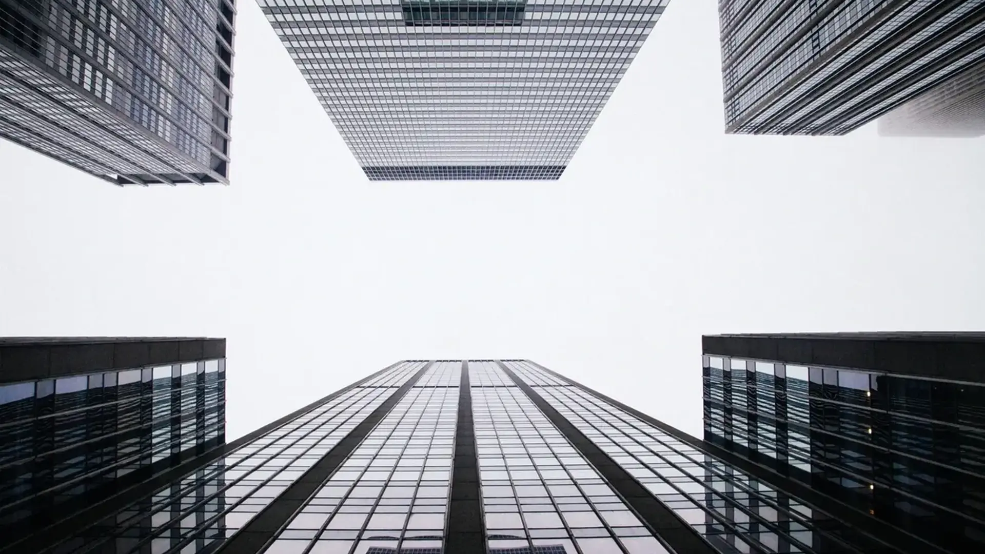 Skyscraper buildings with grey clouds