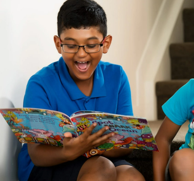 Little boy reading a book