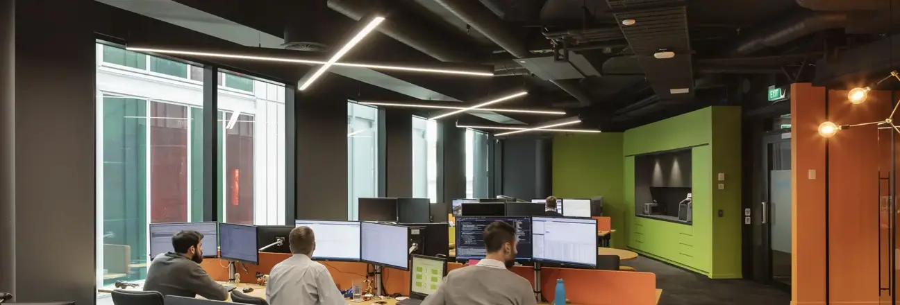 3 men working on computers