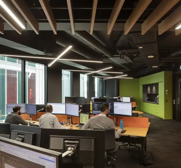 3 men working on computers