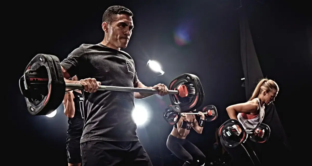 Man lifting weights in workout session