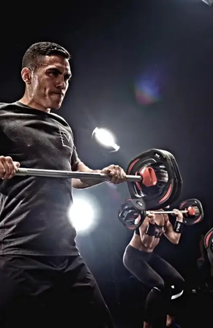 Man lifting weights in workout session