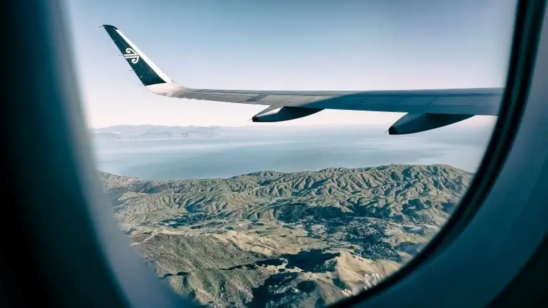 Airplane flying over the mountains