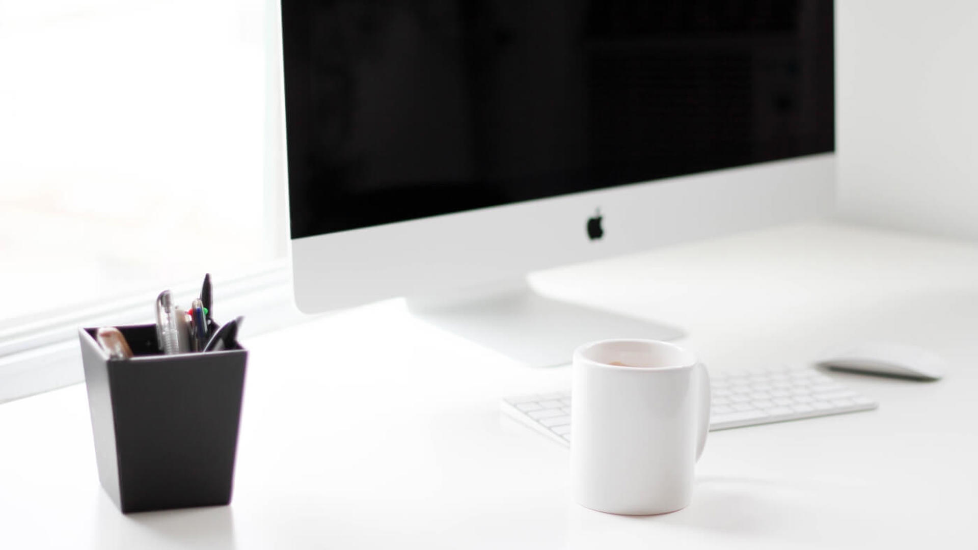 Macbook on a white desk