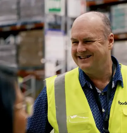 Man smiling in high-vis