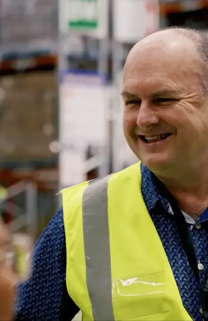 Man smiling in high-vis