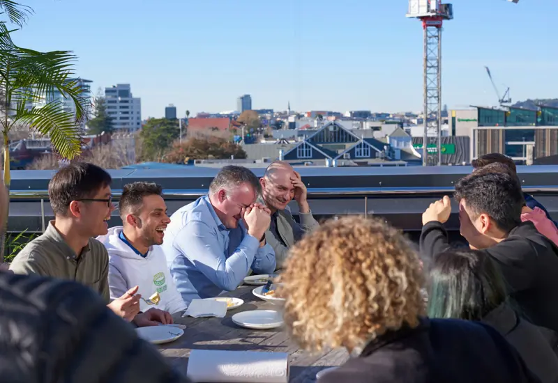 sandfield team morning tea and laughing