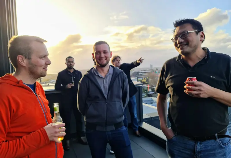 Sandfield team on balcony at dawn