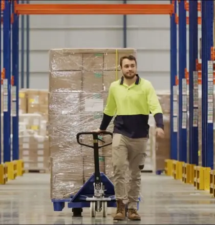 Man in warehouse aisle