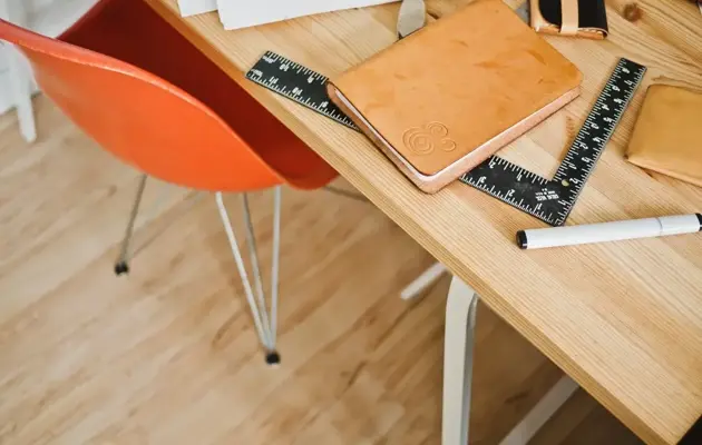 Square Table with orange chair loading=