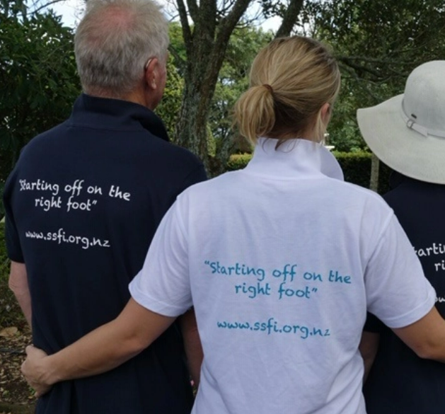 People standing with back of t shirt